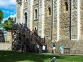 Tourists climbing the wooden stairs to the White Tower of London i